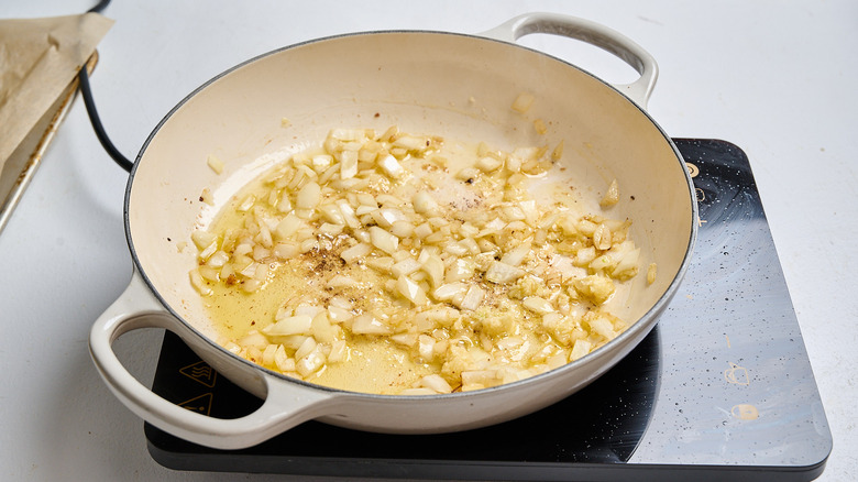 cooking onion and garlic in a skillet
