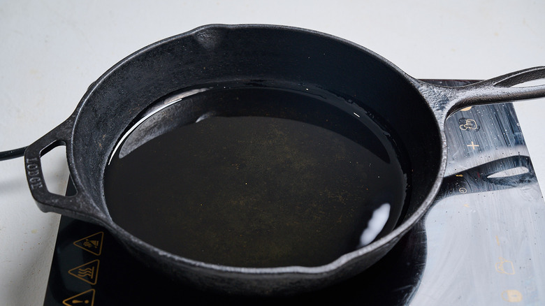 heating oil in a skillet