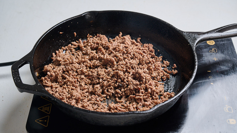 crumbling the beef in a skillet
