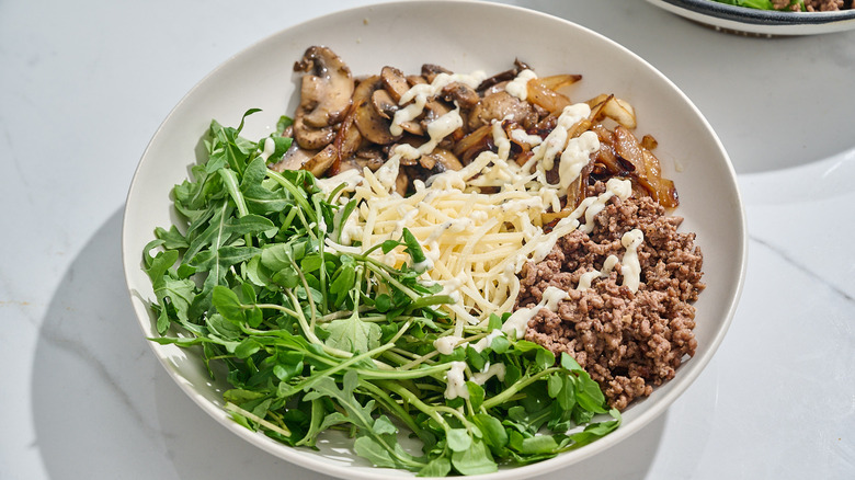 assembled cheeseburger bowl on a table
