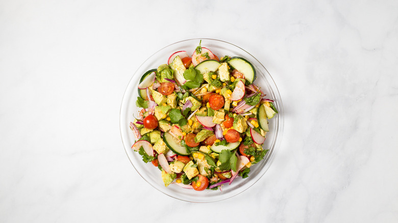 colorful avocado salad on table