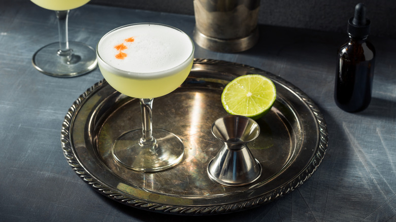 Pisco sour on silver tray