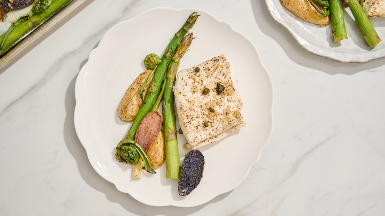 halibut and vegetables on a plate