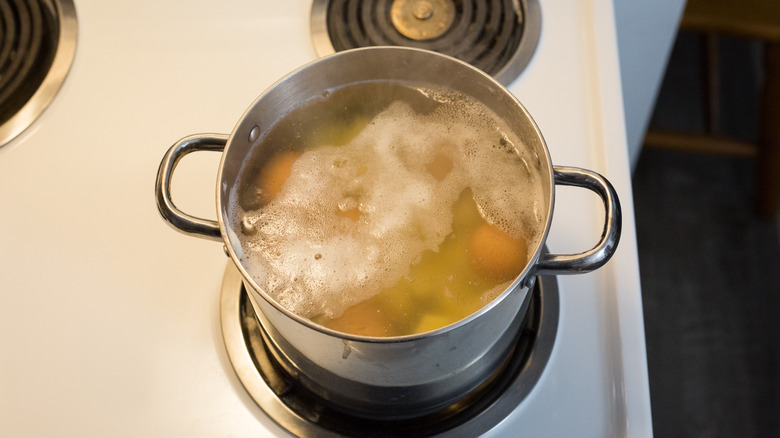 potatoes and eggs in pot