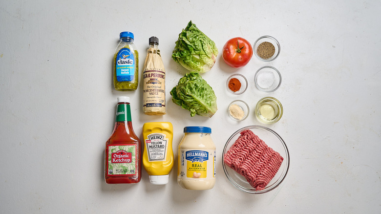 Burger deluxe lettuce wrap ingredients on a table