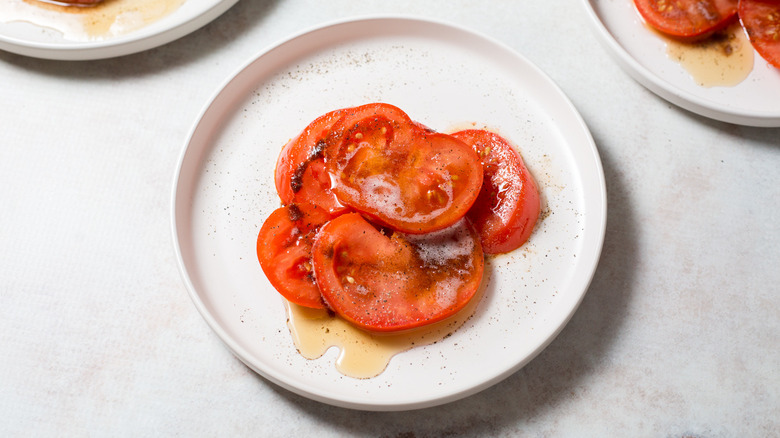 buttery tomatoes served on table