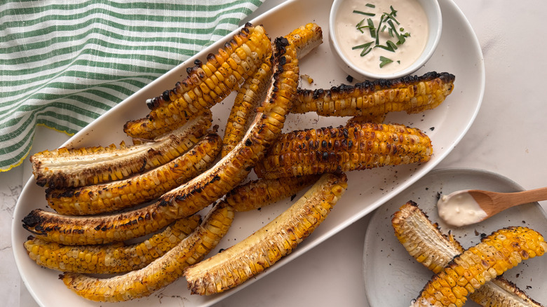 corn ribs on plate with sauce