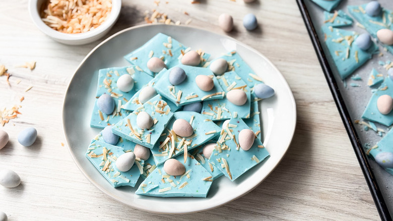 Shards of pastel blue Easter-themed candy bark on plate