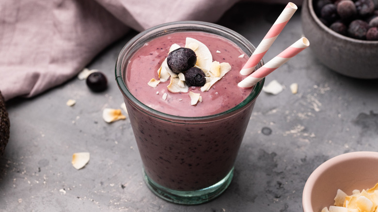 Blueberry smoothie with straws