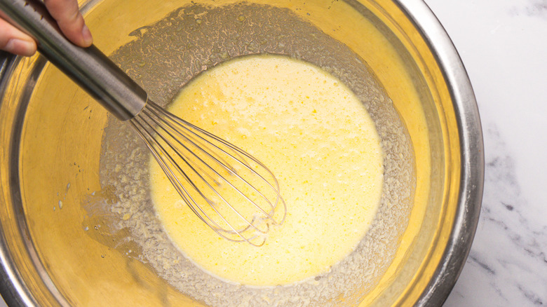 Mixing wet ingredients.
