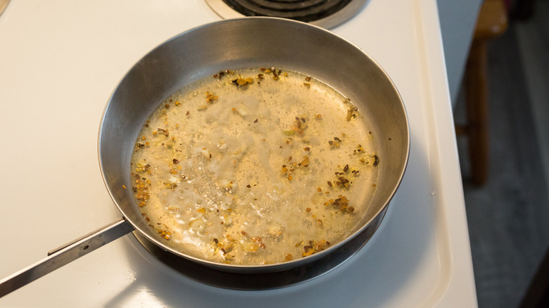 broth simmering in frying pan