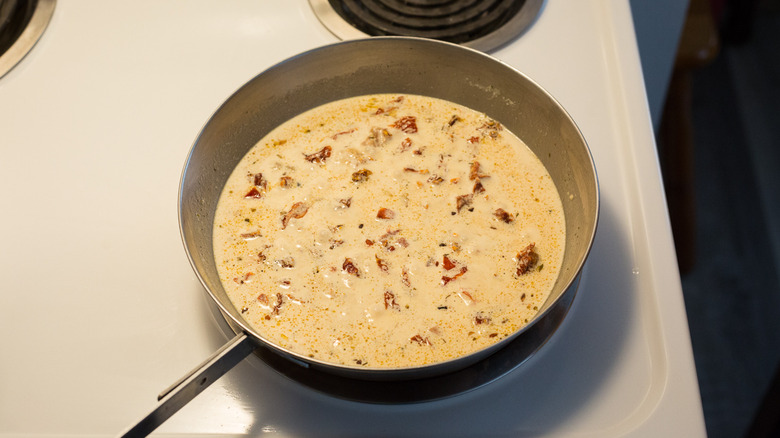 cream sauce cooking in pan