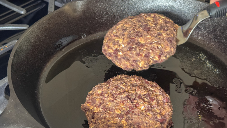 pattie on spatula in pan