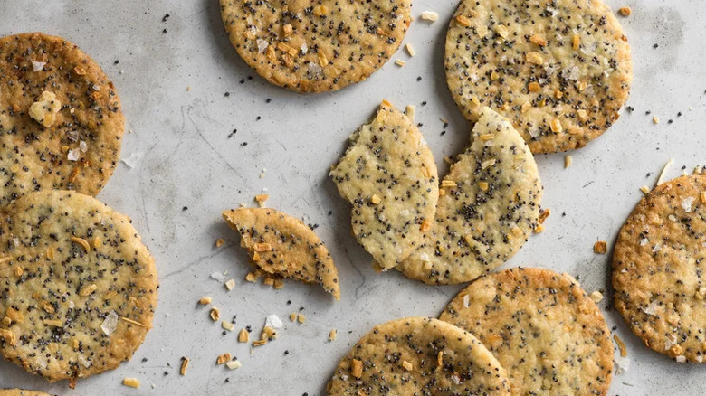 poppy onion crackers on parchment