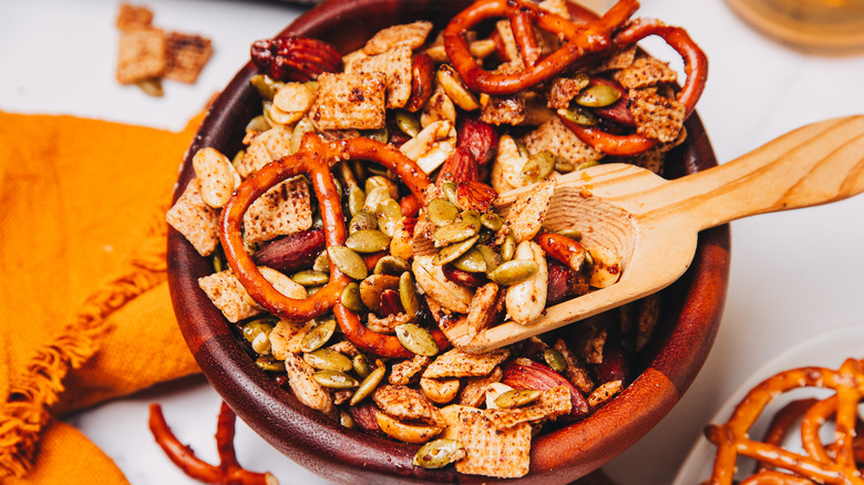 A scoop inside the spicy savory snack mix.