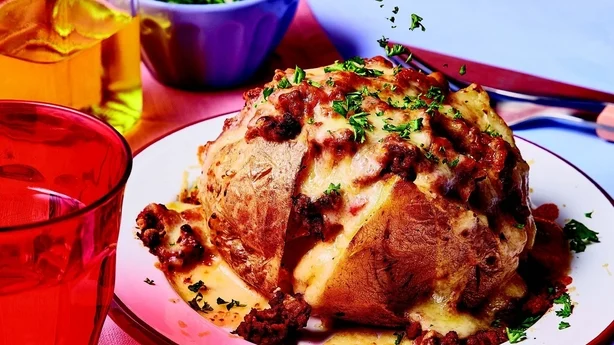 A baked potato topped with lasagne