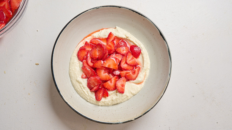 feta topped with strawberries in a bowl