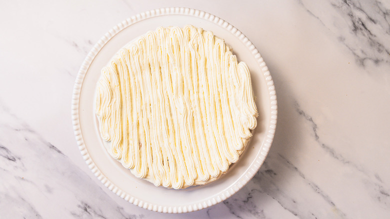 Gluten-free lemon olive oil cake topped with mascarpone.