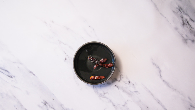 Soaking chiles in warm water.