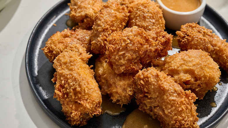 coconut fried wings on a plate