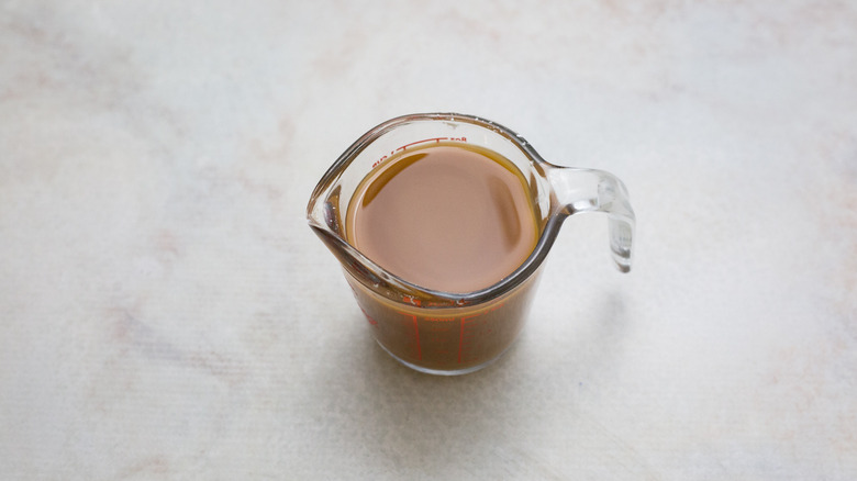 brown sauce in measuring cup