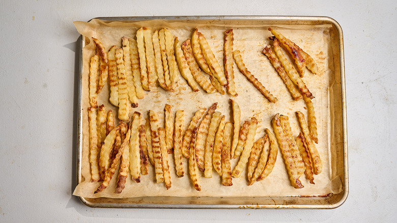 baked french fries on a sheet tray