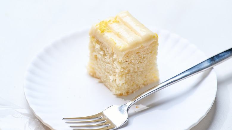 slice of lemon sheet cake on a plate