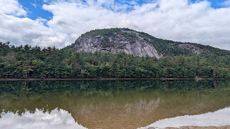 White Horse Ledge reflected in water at Echo Lake State Park