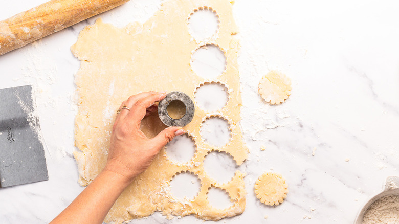Cutting shortbread cookies with cookie cutter