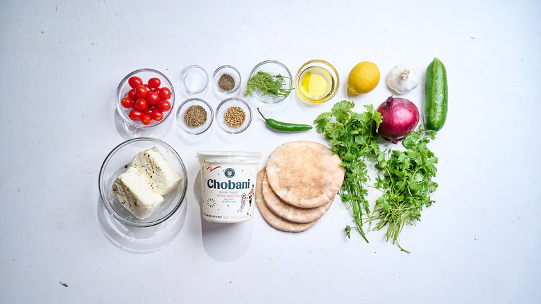 Zhug halloumi pita ingredients on a table