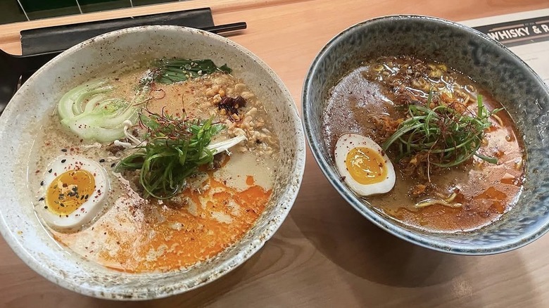 Ramen bowls with egg, noodles, and spices