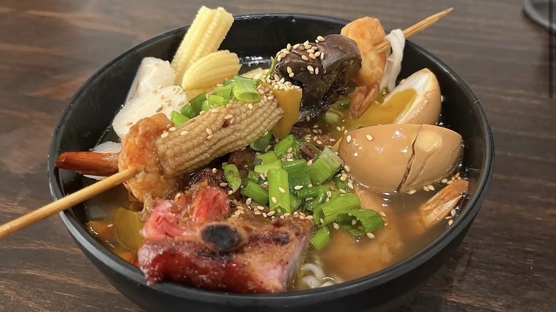 Ramen with soft-boiled egg, baby corn, and vegetables
