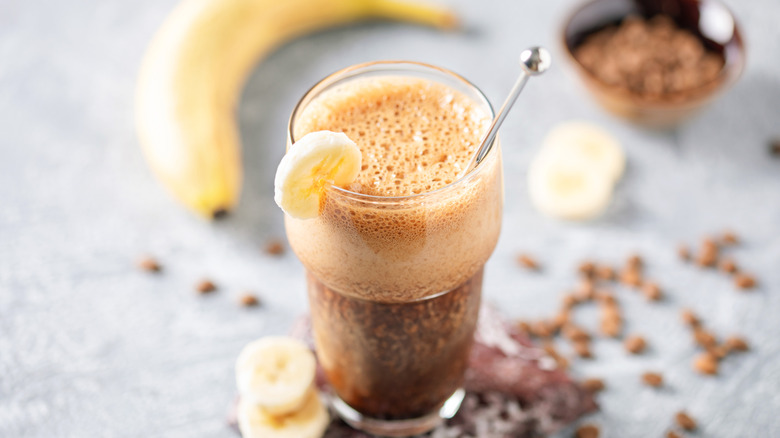 Iced coffee in glass with banana
