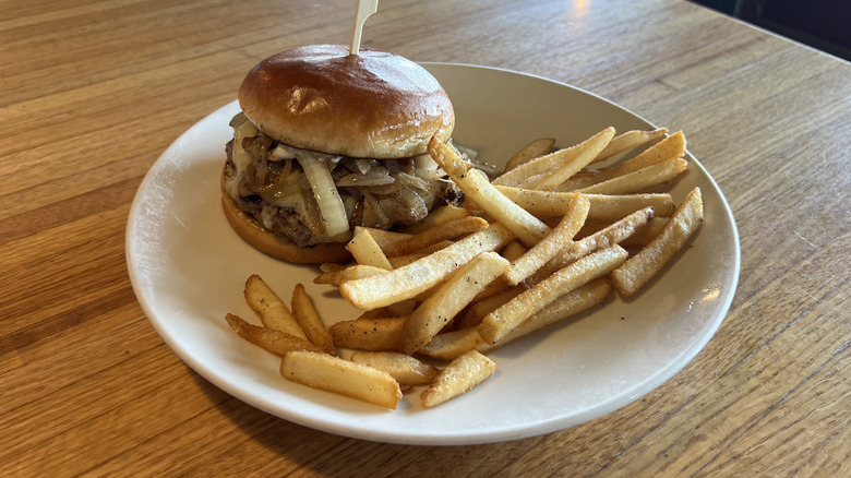 Applebee's Bourbon Street Mushroom Swiss Burger and fries on plate.
