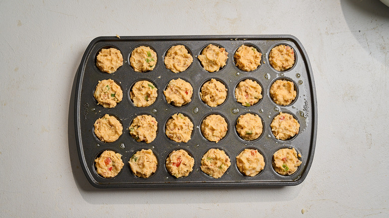 potato mixture pressed into muffin tin