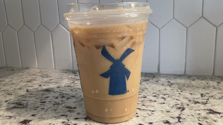 Dutch Bros iced latte on a granite countertop