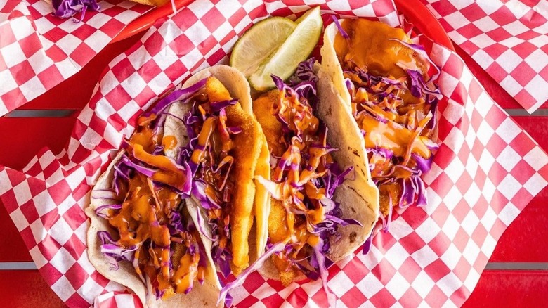 Delicious fish tacos topped with shredded cabbage
