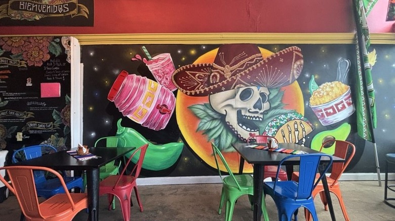 Inside of small and colorful restaurant with chairs