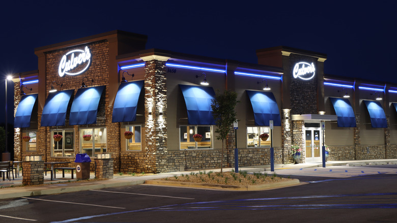 A restaurant late at night with neon sign
