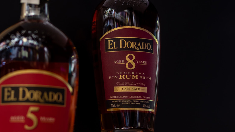 A bottle of El Dorado 8 year Old in the mid-ground with another out-of-focus 5 Year Old Bottle in front.