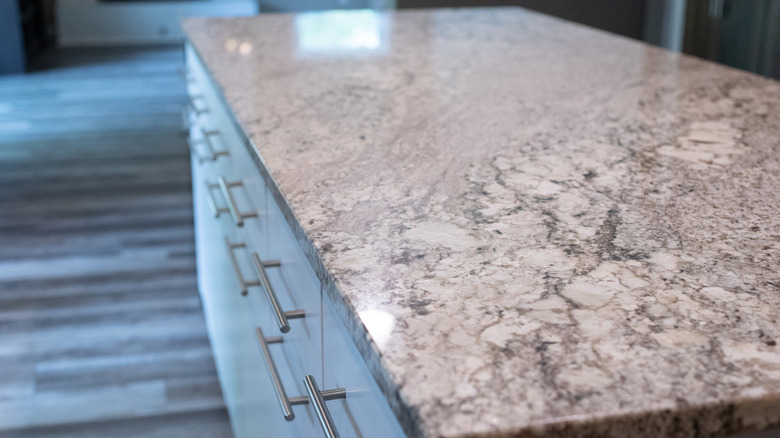 A gray, white, and black granite kitchen countertop