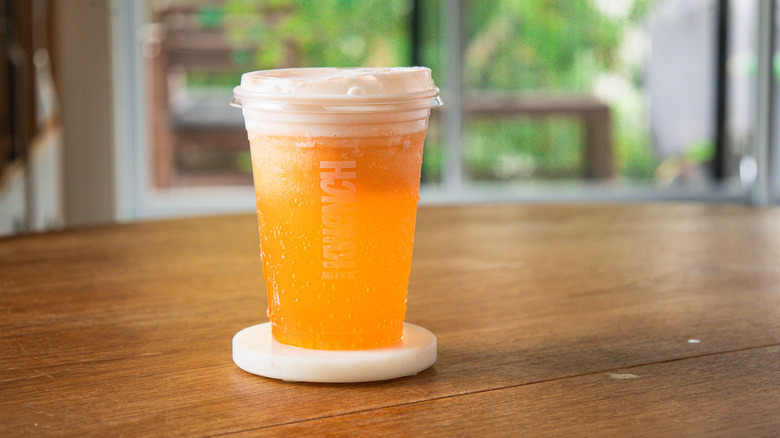 Cheetos Dirty Soda on a coasted on the table