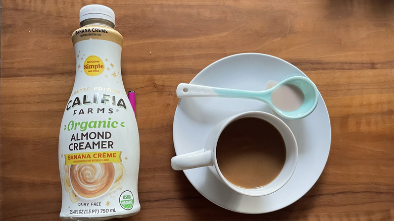 Califia banana creamer in a bottle and in a coffee cup