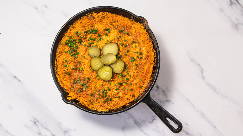 Nashville hot chicken dip with pickles overtop