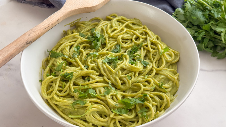 bowl of green spaghetti