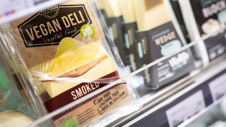 Vegan cheese selection on a shelf at the grocery store