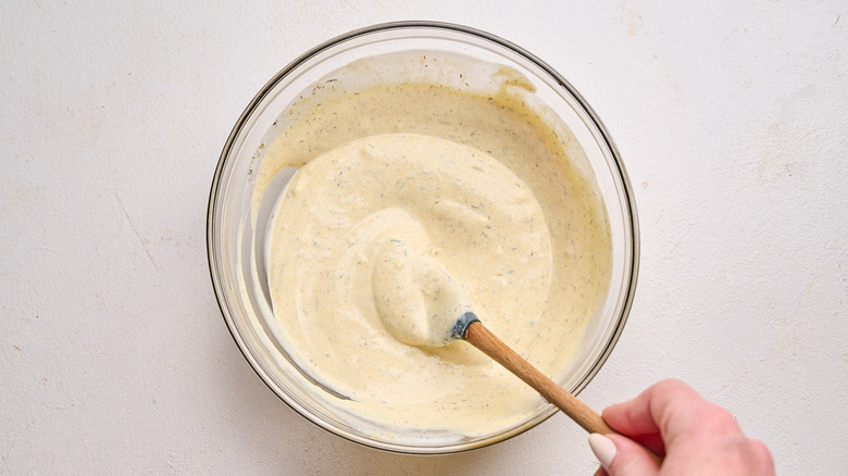 mixing curry ranch together in a bowl