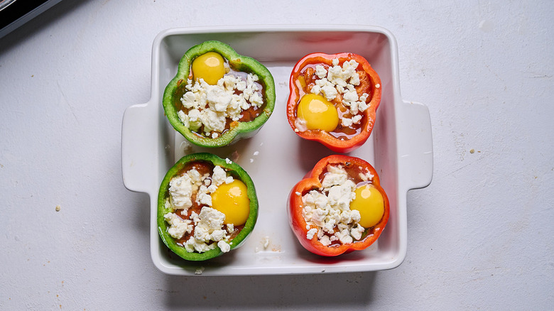topping stuffed peppers with crumbled feta