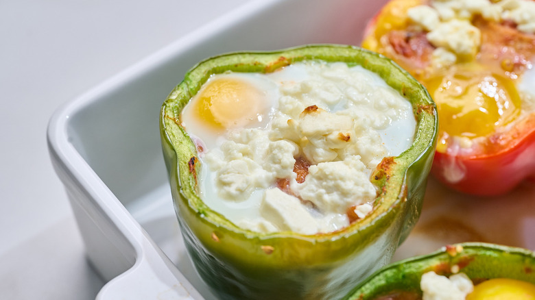 shakshuka stuffed pepper in a casserole dish