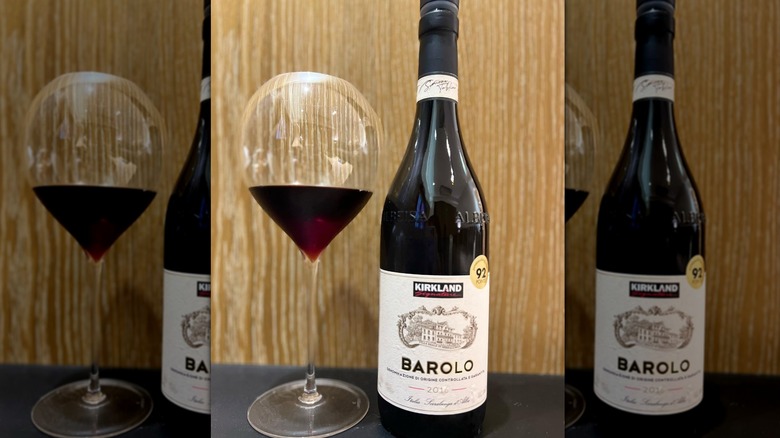 Bottle of Kirkland Signature Barolo next to glass of wine